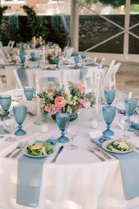 The dusty "something blue" accent color was also incorporated into other moments of the reception decor, such as linens and blue glassware. Dusty Blue Wedding Mood Board, Blue Tablecloth Wedding, White Dinner Table, Wedding Table Scape, Wedding Reception Place Settings, Mansion Garden, Dinner Table Set Up, Blue Wedding Ideas, Pink Wedding Receptions