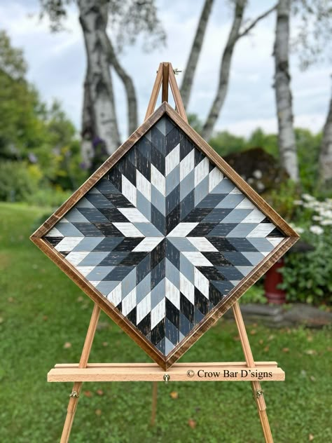 This pretty and dramatic wooden barn quilt features a spiraling star pattern in gray tones.  This is perfect for adding eye-catching appeal to your entryway, living room, or bedroom.  It can also be hung outside on a covered porch or patio setting. Rustic Wood Wall Art - Barn Quilt - Spiral * Measures 25" x 25" (diagonal) or 17 3/4" x 17 3/4" (square) * Hand painted in white, gray, and black colors * Wood Framing * Metal hangers on back for easy wall hanging * Ready to ship in 1-3 business days *Free Shipping USPS Priority Mail This handmade wood wall art is created with premium cedar that is locally sourced here in Vermont.  Each wood cutout of the inlaid geometric design is hand painted and lightly distressed to give the piece a rustic charm and a vintage vibe.  It is framed and finished How To Make Barn Quilts, Wood Quilt Wall Art, Aztec Wall Art, Geometric Wood Wall Art, Geometric Wood Wall, Rustic Wood Wall Art, Neutral Wall Decor, Wall Art Wooden, Barn Wood Projects