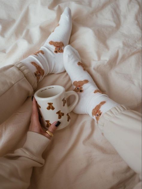 A girl is holding a white mug with teddy bears on it. She has matching socks. Teddy Bear Socks, 17 Doğum Günü, Teddy Bear Mug, Bear Socks, Socks Aesthetic, Bear Mug, Brown Teddy Bear, Beige Outfit, Bear Outfits