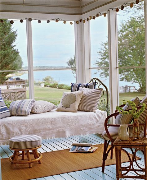 What’s better than a porch by the sea? One outfitted with a hanging bed that’s perfect for sleeping or soaking up a beach read. #porchdecorating #porchideas #frontporchdecor #sleepingporch #southernliving Comfy Cottage, Cottage Rooms, Light Blue Bedding, Antique Iron Beds, Porch Bed, Porch Design Ideas, Cottage Coastal, Cottage Room, Sleeping Porch