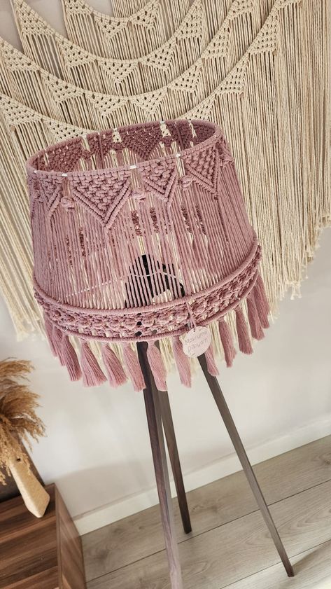 Elevate your space with our exquisite Luxury Handmade Macrame Boho Light, a true embodiment of radiant elegance. This tassel floor lamp doubles as a captivating chandelier, enhancing the bohemian charm of any room. The meticulously crafted Bohemian Lampshade adds a touch of artistry to your space, creating a focal point that reflects your unique style. Indulge in the luxury of handcrafted details and the warmth of ambient lighting, creating an inviting atmosphere. This macrame masterpiece is more than just a lamp; it's a statement piece that effortlessly complements your bohemian-inspired decor. Bring a touch of Bohemian decoration into your home and let the intricate design of this lampshade become a conversation starter, adding character and sophistication to your living space. Illuminat Unique Floor Lamps Bohemian, Macrame Decor Ideas, Crochet Lampshade, Macrame Light, Pink Macrame, Bohemian Decor Inspiration, Macrame Chandelier, Macrame Lamp, Bohemian Decoration