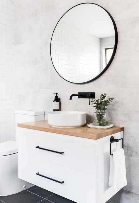 White bathroom with circular mirror and plywood vanity. Round basin accented with black tapware . | Explore Eliza Lee One, an elegant renovated ski retreat in Jindabyne | Inside Out | Photography: The Palm Co #home #style Design Interior Baie, Makeover Kamar Mandi, Modern Boho Decor, Black Faucet, Metal Bathroom, Bad Inspiration, Decor Baie, Apartment Bathroom, Bathroom Renos