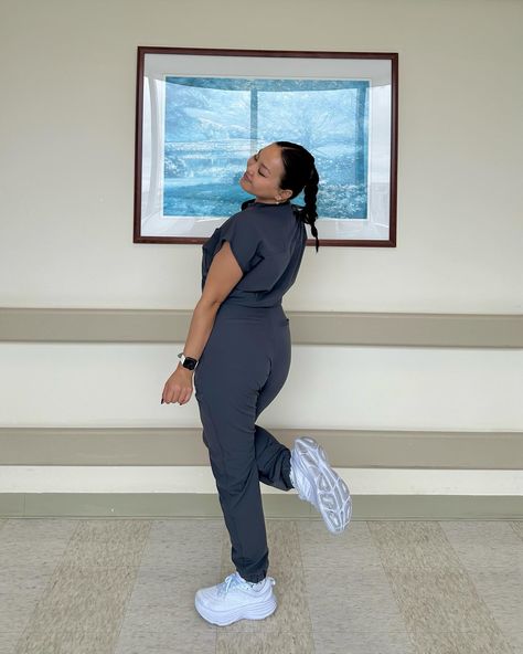 "Channeling my inner fig nurse in this sleek grey jumpsuit. #RockingIt #FigNurseStyle"#figs#NurseLife#scrubstyle#NurseFashion#ComfortandStyle##figsjumpsuit Figs Nurse Aesthetic, Fig Scrubs Women, Maroon Figs Scrubs, Figs Burgundy Scrubs, Figs Scrub Jacket, Grey Jumpsuit, Cute Scrubs, Nursing Fashion, Medical Aesthetic