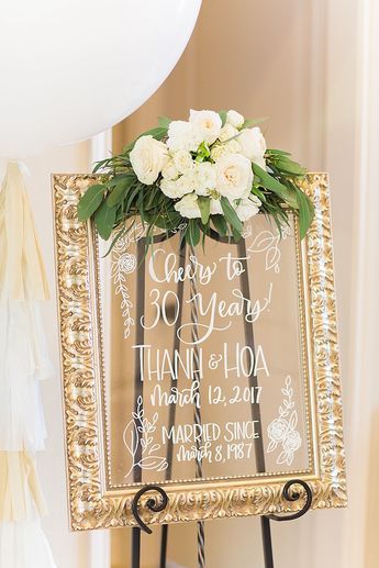 Glass framed party sign from an Elegant Spring Anniversary Party on Kara's Party Ideas | KarasPartyIdeas.com (22) Grandparents Anniversary Party, Happy Anniversary Party Ideas, Anniversary Memory Ideas, White And Gold Anniversary Party, Pearl Anniversary Party Ideas, 25th Anniversary Theme Party Ideas, 30th Anniversary Party Ideas Decoration, 30th Anniversary Party Ideas Decoration 30 Years, Pearl Anniversary Party Decoration