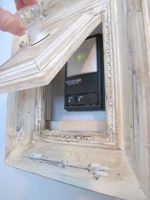 How to turn a picture frame into a gadget to hide your garage door opener. My Uncommon Slice of Suburbia Remodel Farmhouse, Garage Door Opener, Door Opener, Household Hacks, My Dream Home, Thermostat, Home Deco, Home Projects, Home Design