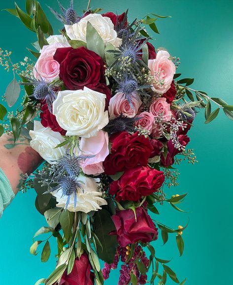 Loving the color combo of red, pink, and white with pops of blue bride- Kim florist/planner- @reneesofridgefieldflowershop 📍IL #floral #flowerpreservation #bouquet #bride #weddinggift #resinart #satisfying #weddinginspo #bouquetpreservation #driedflowers #bridetobe #groomtobe #engagement #preservedflower #weddingideas #handmade #weddingbouquet #flowerart Pink Red And Blue Wedding, Light Pink Bridal Bouquet, Purple Flower Bouquet, Pink Flower Arrangements, Blue Bride, Bridal Bouquet Pink, Bouquet Bride, Red Bouquet, Green Bouquet