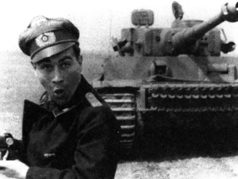 German soldier with PzKpfw IV in the background. Somewhere in the USSR, 1941-1942 Perang Dunia Ii, Mg 34, Military Memes, Panzer Iv, Tiger Ii, German Soldiers Ww2, Ferdinand Porsche, Tiger Tank, German History