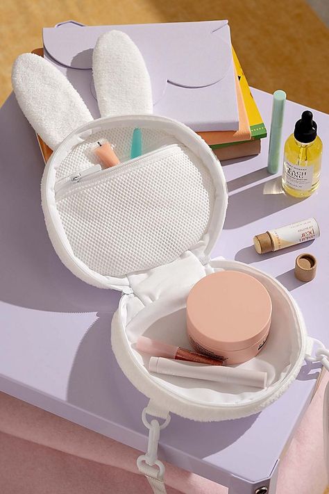 Carry your cosmetics wherever you go with the help of this Miffy makeup bag featuring our fave bunny’s head. Complete with a strap for easy carrying, use this cosmetic bag to transport your makeup and other daily essentials. Features Shaped makeup bag from Smoko Miffy silhouette we love Strap for easy carrying Zip closure Versatile - use it as a makeup bag or purse! Content + Care Polyester Spot clean Imported Size Dimensions: 8" l x 4" w x 10" h Weight: 2 lbs | Smoko Miffy Makeup Bag in White at Urban Outfitters Cos Bags, Bunny Character, Fake Makeup, Australia Clothes, Nintendo Switch Accessories, Makeup Game, Brand Sale, Game On, Cute Bags