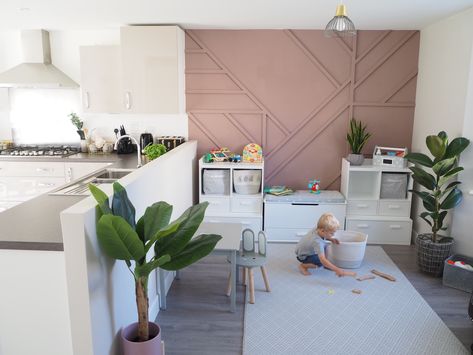 Open-plan Kitchen & Playroom Makeover with Sulking Pink Panelled Feature Wall. Storage from Great Little Trading Company Open Plan Playroom, Dining Room Playroom Combo, Panelled Feature Wall, House Playroom, Playroom Layout, Dining Room Playroom, Playroom Makeover, Kitchen Playroom, Living Room Playroom