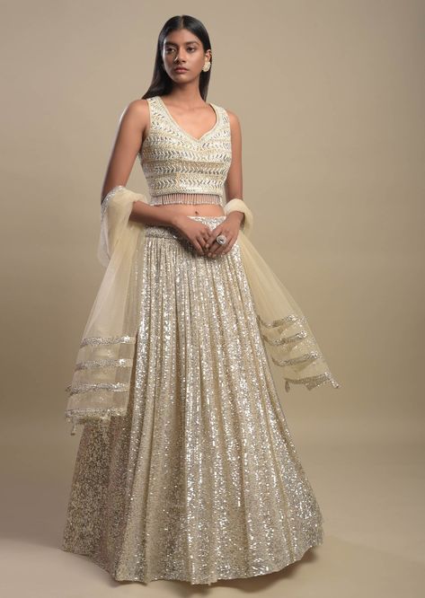 A little shine never hurt anybody, so why not glam up your wedding with some shimmer on your bridal lehengas! We have seen brides going from a classic red colour lehenga to a pastel one. But the one fashion trend that will never go out of style is the shimmer and sequin! It doesn’t matter what function you are attending, you can never go wrong with shimmer lehengas! #bridallehenga #trendinglehenga #latestbridallehenga #uniquelehengaideas #indianbridallehenga #sequinlehenga Checkered Embroidery, Shimmer Lehenga, Lehenga For Engagement, Astha Narang, Wedding Reception Outfit, Latest Bridal Lehenga, Organza Lehenga, Indian Bridal Lehenga, Padded Blouse