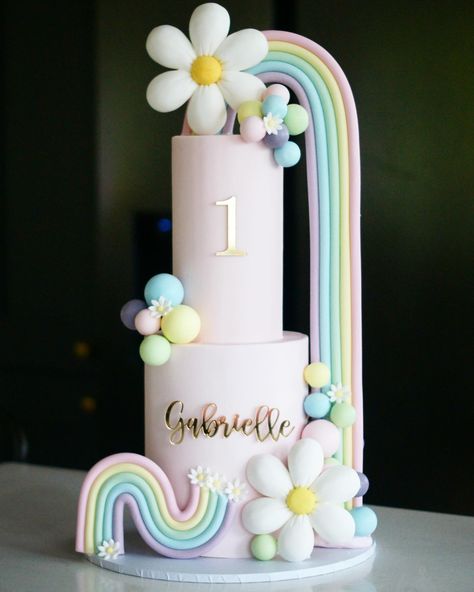 Pretty pastels, large rainbow and daisies 1st birthday cake. 2 tier fondant cake 1st Birthday Cake 2 Tier, Cute Fondant Cakes, 2 Tier Fondant Cake, Birthday Cake 2 Tier, Pink Buttercream Cake, Cake 2 Tier, Rainbow Birthday Cake, Pastel Cakes, Luxury Cake