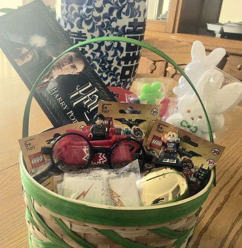 Harry Potter, LEGO Batman inspired Easter Basket. Wand, glasses and scar tattoo, golden egg, and then there's LEGO BATMAN!! Why can't he like candy! Harry Potter Easter Basket, Harry Potter Lego, Batman Inspired, Scar Tattoo, Raffle Baskets, Golden Egg, Spring Fun, Gift Inspiration, Lego Batman