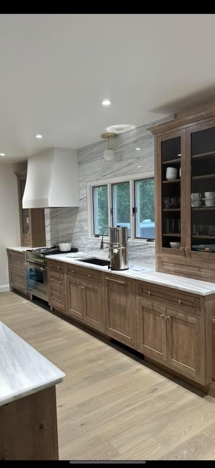 Cabinets - Cappuccino stain on cherry; Marble - calacatta altissimo Cherry Cappuccino Cabinets, Stained Cherry Kitchen Cabinets, Mocha Cabinets Kitchen, Schuler Cabinets, Medallion Cabinets, Marble Calacatta, Cherry Kitchen, Brown Cabinets, Cherry Cabinets