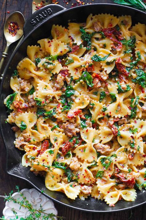 Creamy Sausage and Kale Pasta with Sun-Dried Tomatoes - in a cast iron skillet. Sausage And Kale Pasta, Sausage Kale Pasta, Sausage And Kale, Sausage Kale, Kale Pasta, Sausage Tortellini, Italian Sausage Pasta, Lentil Pasta, Vegan Mozzarella