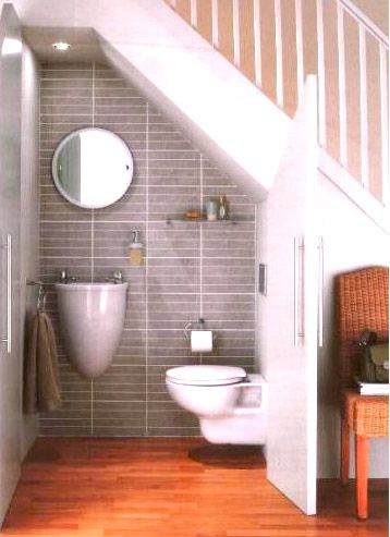 7 Under Stairs Storage Ideas -Bedrooms, Living Rooms & More Tiny Bathroom Sink, Understairs Toilet, Space Under Stairs, تحت الدرج, Bathroom Under Stairs, Secret Doors, Under The Stairs, Bad Inspiration, Tiny Bathrooms