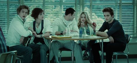 The Cullens are all matching except for Edward — the only one at the table not wearing white for some reason. (Uh, did you not get the memo, Eddy?) Catherine Hardwicke, Twilight 2008, Twilight Photos, Twilight Film, The Cullen, Twilight Pictures, Kellan Lutz, Twilight Fans, Twilight Movie