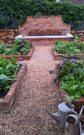 Brick raised beds, gravel path, walled fountain #raisedbedsbrick Brick Raised Beds, Native Gardens, Brick Garden, Backyard Designs, Gravel Path, Potager Garden, Vegetable Gardens, Garden Types, Home Vegetable Garden