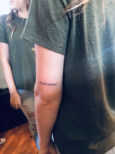 Roman Numerals Back Of Arm, Roman Numeral Arm Tattoo, Back Of Arm Word Tattoo, Roman Numeral Tattoo On Arm, Roman Numeral Tattoo Arm, Roman Numeral Date Tattoo, Children Tattoo, Vertical Tattoo, Roman Letters