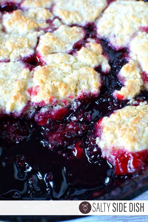 Blackberry cobbler with fresh blackberries and a homemade biscuits topped with course sugar, is a delicious dessert that takes the place of pie in a pinch. Cobbler is super holiday friendly and often served as a fall dessert. You won’t believe how easy it is to make the best blackberry cobbler ever so let’s getContinue Reading Southern Blackberry Cobbler, Easy Blackberry Cobbler, Salty Side Dish, Strawberry Angel Food Cake, Berry Cobbler Recipes, Peach Cobbler Dump Cake, Blackberry Cobbler Recipe, Cobbler Recipes Easy, Blueberry Dump Cakes