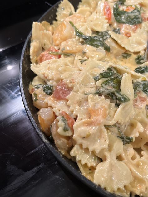 Bowtie pasta, shrimp, spinach, tomatoes, garlic, Alfredo sauce Bow Tie Alfredo Pasta, Buffalo Shrimp Pasta, Spinach Alfredo Pasta, Shrimp Spinach Pasta, Garlic Alfredo Sauce, Olive Garden Alfredo, Bow Tie Pasta Recipe, Shrimp Spinach, Shell Pasta Recipes