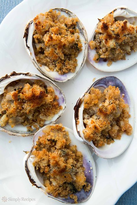 Baked Stuffed Clams ~ Minced clams mixed with butter, onions, parsley, and bread crumbs, spooned into half clam shells and baked. Quahog Stuffies recipe. ~ SimplyRecipes.com Stuffies Recipe, Baked Clams Recipe, Stuffed Clams, Baked Stuffed Shrimp, Clams Casino, Clam Sauce, Best Seafood Recipes, Clam Bake, Clam Recipes