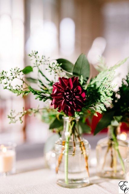 Burgundy Flowers | Bud Vase | Designed by Engaging Events Bud Vases Burgundy Flowers, Burgundy Wedding Table Flowers, Winter Bud Vase Arrangements, Burgundy Bud Vase Centerpiece, Simple Burgundy Wedding Centerpieces, Christmas Bud Vase Ideas, Winter Bud Vases, Burgundy Bud Vases, Christmas Bud Vases