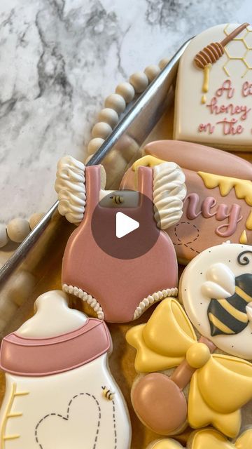 Breanna Deeds on Instagram: "A baby outfit or baby rattle are two of my most favorite cookies to decorate 😍  #customcookies #decoratedcookies #cookiesofinstagram #cookieart #edibleart #babyshowercookies #alittlehoneyisonthewaycookies #whatwillbabybeecookies #sweetascanbeecookies #beecookies #cookiedecoratingvideos #oddlysatisfying #satisfyingvideos" Baby Rattle Cookies, Cookies To Decorate, Onesie Cookies, Bee Cookies, Cookie Inspiration, Baby Shower Cookies, Oddly Satisfying, Cookie Art, Baby Rattle