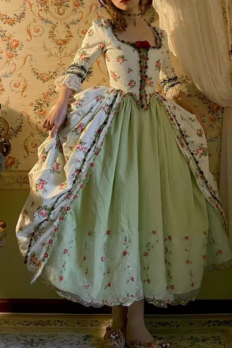 Immerse yourself in the opulent elegance of the Rococo era with our stunning Marie Antoinette-inspired ball gown. This exquisite dress, featuring a pastel green skirt and a pink floral bodice, seamlessly blends historical charm with modern sophistication, making it the perfect choice for a fairy-tale wedding. Rococo St Georgian Dresses 18th Century, Bodice Embroidery Design, Rococo Fashion Modern Style, 1770 Dress, Rococo Style Fashion, Rococo Inspired Fashion, 18th Century Wedding Dress, Rococo Fashion Modern, 1700s Aesthetic