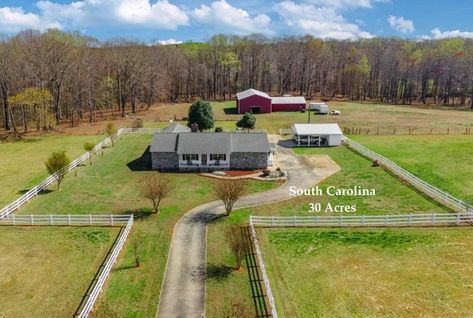 A long drive takes you down to this South Carolina home for sale on 30 acres. The ranch style home sits back from the road with a garage and a barn. Land is level, partially open, partially wooded.

Nestled on 30 acres of breathtaking land, this property offers tranquility & charm. Relax on the covered front rocking chair porch & admire the scenic views.
#acreage #barn #BeautifullyLandscaped #countryhomeforsale #farmhousewithacreage #HardwoodFloors #IngroundPool #LargeRooms #NaturalLight Country Ranch Style Homes, South Carolina Homes, Rocking Chair Porch, Bus Conversion, Long Drive, Ranch Style Homes, Ranch Style Home, Inground Pools, Rural Life