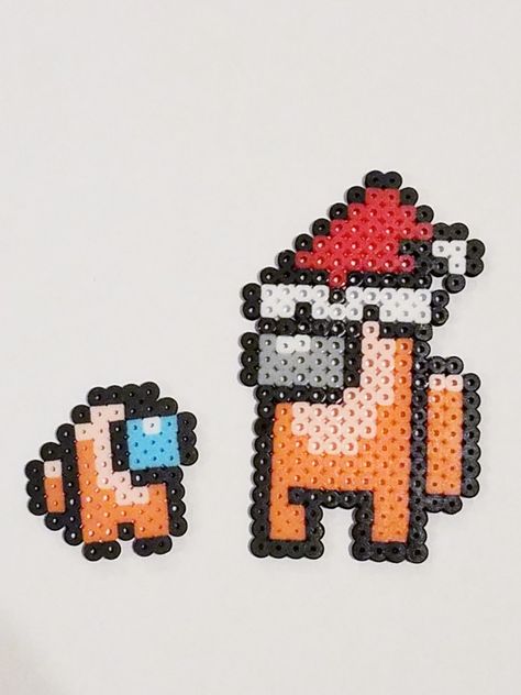 Among us orange with Santa hat and baby crewmate Among Us Perler Beads, Among Us Orange, Perler Pattern, Perler Art, Diy Perler Bead Crafts, Handmade Keychain, Hama Beads Patterns, Cross Stitch Books, Melty Beads