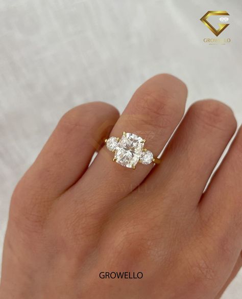 2.0CT Cushion And Round Cut Three Stone Lab Grown Diamond Unique Designer Engagement Ring 10K/14K/18K Gold Wedding Ring Anniversary Ring For Her ◈ Diamond Type & Color-Clarity ◈ ⇾ Lab-grown: E-F / VVS-VS ◈ Center Diamond Details ◈ ⇾ Diamond Shape: Cushion Cut ⇾ Diamond Pcs: 1 ⇾ Diamond Weight: 2.00 CT (center stone) ⇾ Diamond Size: 7.34X7.34X4.70mm Approx. ◈ Side Diamond Details ◈ ⇾ Diamond Shape: Round Cut ⇾ Diamond Pcs: 2 ⇾ Diamond Weight: 0.50 - 0.55CT Approx. ◈ Ring Details ◈ ⇾ Jewelry Certi Cushion Cut Engagement Rings With Side Stones, 3 Stone Elongated Cushion Engagement Ring, Elongated Cushion Three Stone Engagement Ring, Elongated Cushion Engagement Ring With Side Stones, Elongated Cushion With Side Stones, Cushion Cut Three Stone Engagement Ring, 3 Stone Cushion Engagement Ring, Elongated Cushion Engagement Ring Silver, Three Stone Elongated Cushion