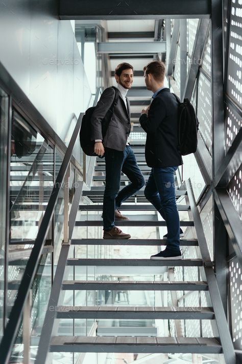 Two men going up, down stairs while chatting by arthurhidden. Two young businessmen going up, down the stairs while chatting in a modern building. #Sponsored #chatting, #arthurhidden, #men, #stairs Going Up Stairs Reference, Walking Down Stairs Reference, People On Stairs, Stairs Reference, Walking Down Stairs, Going Up The Stairs, Walking Up The Stairs, How To Draw Stairs, Walking Up Stairs