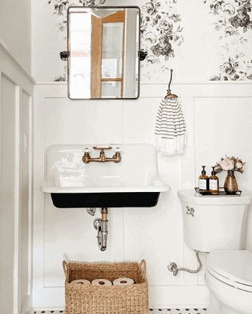 Vintage Sink Powder Room, French Sink Bathroom, Wall Mount Powder Room Sink, Vintage Sink Bathroom, Vintage Wall Mount Sink, Powder Room With Laundry, Room With Floral Wallpaper, Farmhouse Trough Sink, Black And White Powder Room