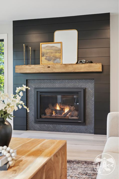 Create a bold focal point in your living room with a black shiplap fireplace—one of the hottest 2024 design trends! 🖤🔥 This sleek, modern look adds both warmth and elegance, transforming your space into a cozy, stylish retreat.

Read all about it in our blog!

#blackshiplapfireplace #modernhomedesign #livingroomdecor #fireplaceinspiration #shiplapstyle #homedesigntrends #cozyspaces #interiordesign #fireplaceideas #moderndesign Dark Shiplap Fireplace With Wood Mantle, Black Tile And Shiplap Fireplace, Black Shiplap Living Room, Dark Grey Shiplap Fireplace, Black Fireplace With Shelves, Black Fireplace Wall Living Room, Modern Fireplace With Hearth, Shiplap Wall With Fireplace, Living Room Shiplap Wall