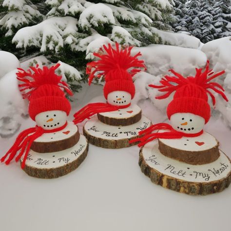 Hurry! Before they melt away. Despite the chilly weather outside, these snowmen are melting with warmth from the holiday season indoors. Each snowman features a unique bottom wood slice, adding to their individual charm while maintaining consistent heights. Adorned with a small red scarf and a matching red tassel cap, every snowman holds a heartfelt red heart engraved with the inscription: 'you melt my heart'. These adorable melting snowmen are the perfect addition to your holiday decor, ideal for snowman enthusiasts and collectors alike. They make delightful gifts for Secret Santa exchanges, grab bags, or as charming stocking stuffers. PLEASE NOTE Due to the nature of these wood slices, there will be some imperfections on the surface of the slice as well as some pieces of bark will fall o Wood Slice Snowman, Christmas Deer Decorations, Melting Snowmen, Diy Stocking Stuffers, Melted Snowman, Wooden Snowman, Wood Slice Crafts, Sweet Message, Diy Dollar Tree Decor