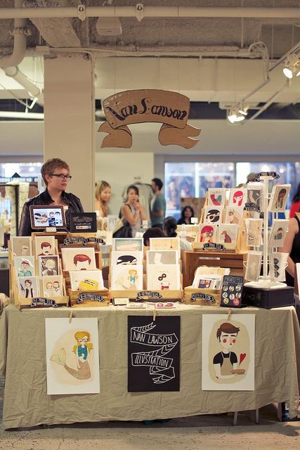 IMG_4652 by UNIQUE LA/NYC/SF, via Flickr She hung her sign from the ceiling pipes. Craft Stall Display, Art Fair Display, Market Stall Display, Craft Displays, Art Fair Booth, Quotes Valentines Day, Merchandising Tips, Stall Display, Craft Market Display