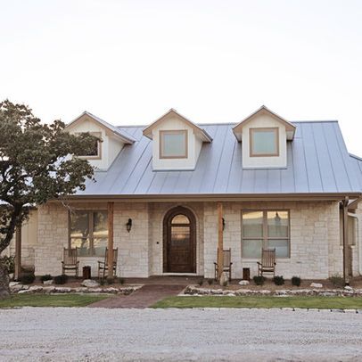 “glass,and limestone veneered walls. The roof is galvalume standing seam with three dormers. It offers a very comfortable and inviting appearance to country living. Rebecca McCoy Photography” “white limestone. It is very common around the Texas Hill Country area. My local supplier is Hill Country Stone (830)895-1366. The sizes are 4, 6, and 8 mix.” “The stone is a chopped white limestone.” Limestone House, Farmhouse Style Exterior, Austin Stone, Ranch House Remodel, Hill Country Homes, Building A Porch, Home Exterior Makeover, Traditional Exterior, Exterior Remodel