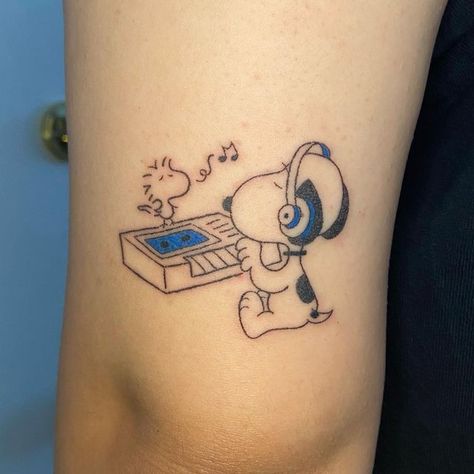 🌿 Julianne Marella Villegas 🌿 on Instagram: "A funky lil ~2.25” snoopy & woodstock hanging out on her arm 🎹🐶🎧🐥🎵 thank you for the trust w this piece, i had a fun time making this custom for ya & i’m so stoked w how it came out :•)) #tattoo #sacramentotattoo #handpoke #stickandpoke #diytattoo #qttr #machinefreetattoo #qtpoctattooer #snoopy #snoopytattoo #peanutstattoo" Matching Snoopy Tattoos, Snoopy Woodstock Tattoo, Small Snoopy Tattoo, Peanuts Tattoos, Snoopy And Woodstock Tattoo, Charlie Brown Tattoo, Peanuts Tattoo, Snoopy Tattoo Ideas, Woodstock Tattoo