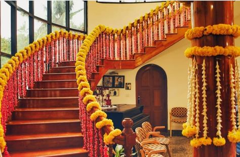 Floral staircase with marigold looks beautiful.... #indianwedding #indianweddingblog #saree #designerblouse #teluguwedding #telugubride #tamilwedding #tamilbride #weddingbrigade #gorgeousbride #shopzters #shaadimagic #bridesessentials #ezwed #pellipoolajada #southindianbride #southindianwedding #templejewellery #southindianweddingdecor Marigold Staircase Decor, Gruh Pravesh Decoration, Wedding House Decoration, Wedding Staircase Decoration, Floral Staircase, Wedding Stairs, Wedding Staircase, House Warming Decor, Weddings Decorations Elegant Romantic