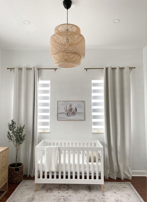 Neutral decor baby nursery with white crib, rattan pendant, black out curtains, neutral rug. White Carpet Nursery, White Crib Neutral Nursery, Boy Nursery With White Crib, Boy Nursery White Crib, White Crib Boy Nursery, Nursery White Crib, White Crib Nursery, Nuetral Nursery, Nursery Rugs Boy