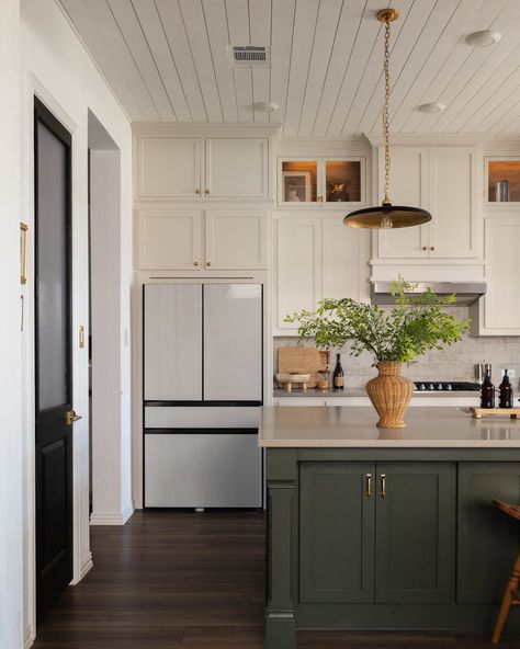 Kitchen with cream top cabinets and green cabinets on kitchen island. Green Kitchen Cabinets With White Appliances, Half Green Kitchen Cabinets, Beige Cabinets Green Island, Cream And Green Cabinets, Green And Ivory Kitchen Cabinets, Green And White Galley Kitchen, Kitchen Ideas Green Island, Olive Cabinets, Green Beige Kitchen Cabinets