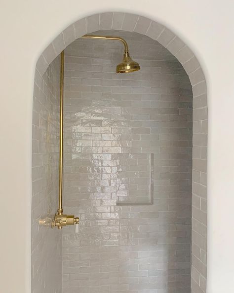 Half circle arch entry to shower, gold shower system, zellige tile. Riad Tile, Gold Fixtures, Master Bath Remodel, Zellige Tile, Brass Fixtures, Moroccan Tile, Bathroom Redo, Cement Tile, Bath Remodel