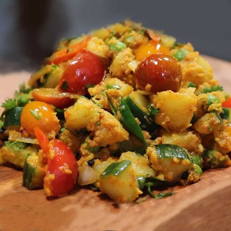 A nepali dish made with potatoes, cucumber, tomatoes, peas and onions seasoned with seeds, spics and oils. Nepali aloo ko achar- simple and flavourful potato pickle recipe. Sliced cucumbers, radishes and green chillies can also be added in these pickles also with Timur which is a nepali spoce with a very strong and tongue tickling flavour. Nepali Pickle, Nepali Recipes, Peas And Onions, Pickling Cucumbers Recipe, Pickle Recipe, Air Fryer Dinner Recipes, Fenugreek Seeds, Red Chili Powder, Boiled Potatoes