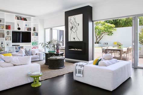 “Walking through the front door of this home is like entering a sanctuary,” says Tim. “The outside is invited in, and that makes the house feel more spacious.” Filled with books, photos and trinkets rich in personal meaning, the custom bookcase makes a large space feel more intimate. **Sofas** from [Weylandts](http://www.weylandts.com.au/?utm_campaign=supplier/|target="_blank"), **coffee tables** and **stool** from [Blu Peter](http://www.blupeter.com.au/?utm_campaign=supplier/|target="_blank... Open House Plans, Homes To Love, Open Plan Living Room, Cafe Chairs, Lounge Room, Open Plan Living, Open Plan, Upholstered Chairs, Living Room Chairs