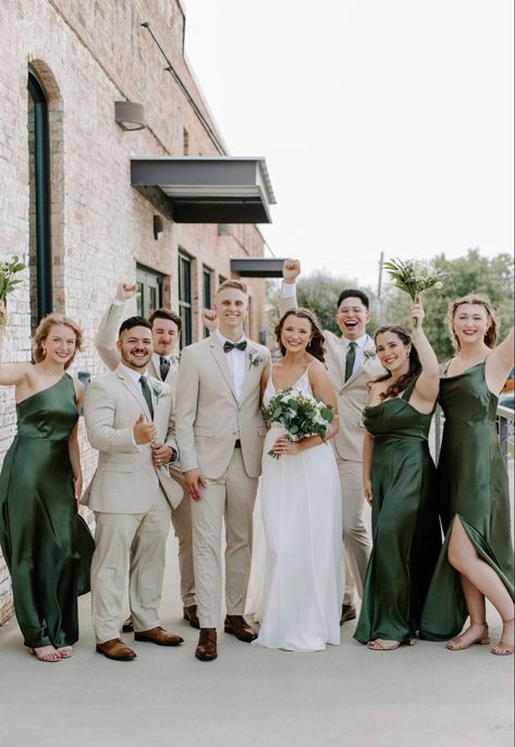 Green Suit Champagne Tie, Tan Suit With Emerald Green, Groomsmen Attire Beige And Green, Green And Gold Wedding Party Attire, Tan And Emerald Green Suit, Tan Suit With Green Bow Tie, Khaki Green Wedding, Bridesmaid And Groomsmen Pictures Green, Eucalyptus Wedding Party Groomsmen