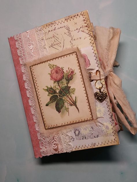 Floral Journey junk journal features beautiful vintage floral images on every page, as well as blank spaces for your thoughts and memories. This journal is 6 inches tall and 4.25 inches wide with a fabric and vintage trim binding, heart charm, and a muslin tie closure.  Contains 40 pieces of removable ephemera including embellished tags and notecards, paper cluster pad, vintage lace pockets, 2 small floral journals with tie closures, pocket tags, decorated coin envelope, and an envelope folio for notes. The journal has 70 pages (many fabric edged) in two signatures with a one inch spine. The pages are coffee stained paper and pages from vintage gardening books. Only one available, uniquely designed to keep with the theme of the journal. This journal is handmade and intended to have a vinta Junk Journal Cover Ideas Diy, Vintage Journal Ideas, Junk Journal Accessories, Binder Junk Journal, Journal Toppers, Junk Journal Cover Ideas, Ring Bound Junk Journals, Wedding Junk Journal, Junk Journal Covers