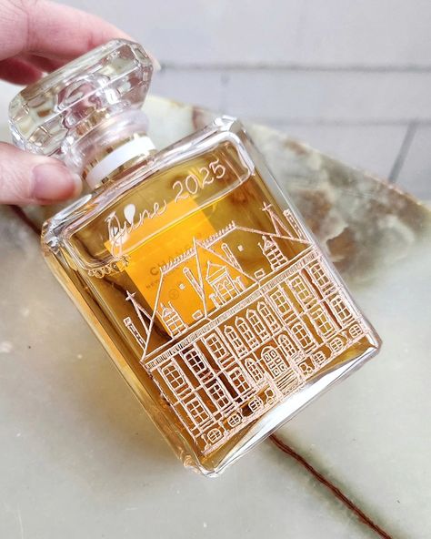 Some recent creative challenges I've enjoyed: engraving venues! I love how you can see the venue from the front of the Chanel bottle, too. Another way to personalize a long-lasting gift ❤️. Could be lovely for a housewarming gift, too. #perfumeengraving #calligraphyengraving #weddingvenues #glassengraving #personalizedgiftideas #engravedperfume #weddingpartygifts #bridalpartygifts #houseillustration | Perfume bottle engraving Rochester NY Perfume Engraving, Perfume Illustration, Personalized Perfume, Chanel Bottle, Engraved Perfume, Bottle Engraving, Custom Perfume, Fragrance Bottles, Glass Engraving