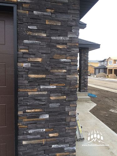 RR Masonry in Lethbridge Alberta Canada shows off its work with Greenwood Homes. Here is our Stacked Stone profile in our Black Diamond color. www.KodiakMountain.com Home Elevation Tiles Design, Wall Tiles Outside House, Show Wall Design Exterior, Outside Wall Tiles, Home Front Wall Tiles Design, Tiles For Outside House Wall, Exterior Wall Tiles House, Wall Stone Design, Wall Design Outdoor