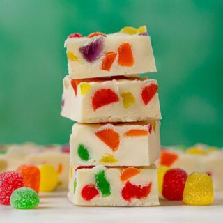 Gumdrop Fudge in a stack with green background Gumdrop Fudge, Gumdrop Candy, Holiday Fudge, Dinner Then Dessert, White Chocolate Fudge, Oh Fudge, Easy Holiday Desserts, Xmas Treats, Vanilla Fudge