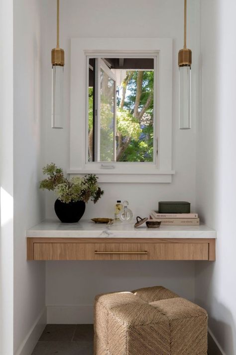 The Ainsley Stool from the @kirk_nix collection adds natural texture and comfort to this vanity nook. Its low profile makes it the perfect complement to small spaces where it can be easily tucked away when not in use.  #Palecek // @kirk_nix Collection // Design: @emerson.gracedesign // Photography: @jessicabrydsonphotograph Oak Makeup Vanity, Nook Vanity, Built In Makeup Vanity, Vanity Nook, Dining Table Lighting, Chandelier Table Lamp, Vanity Ideas, Primary Bedroom, Ottoman Stool